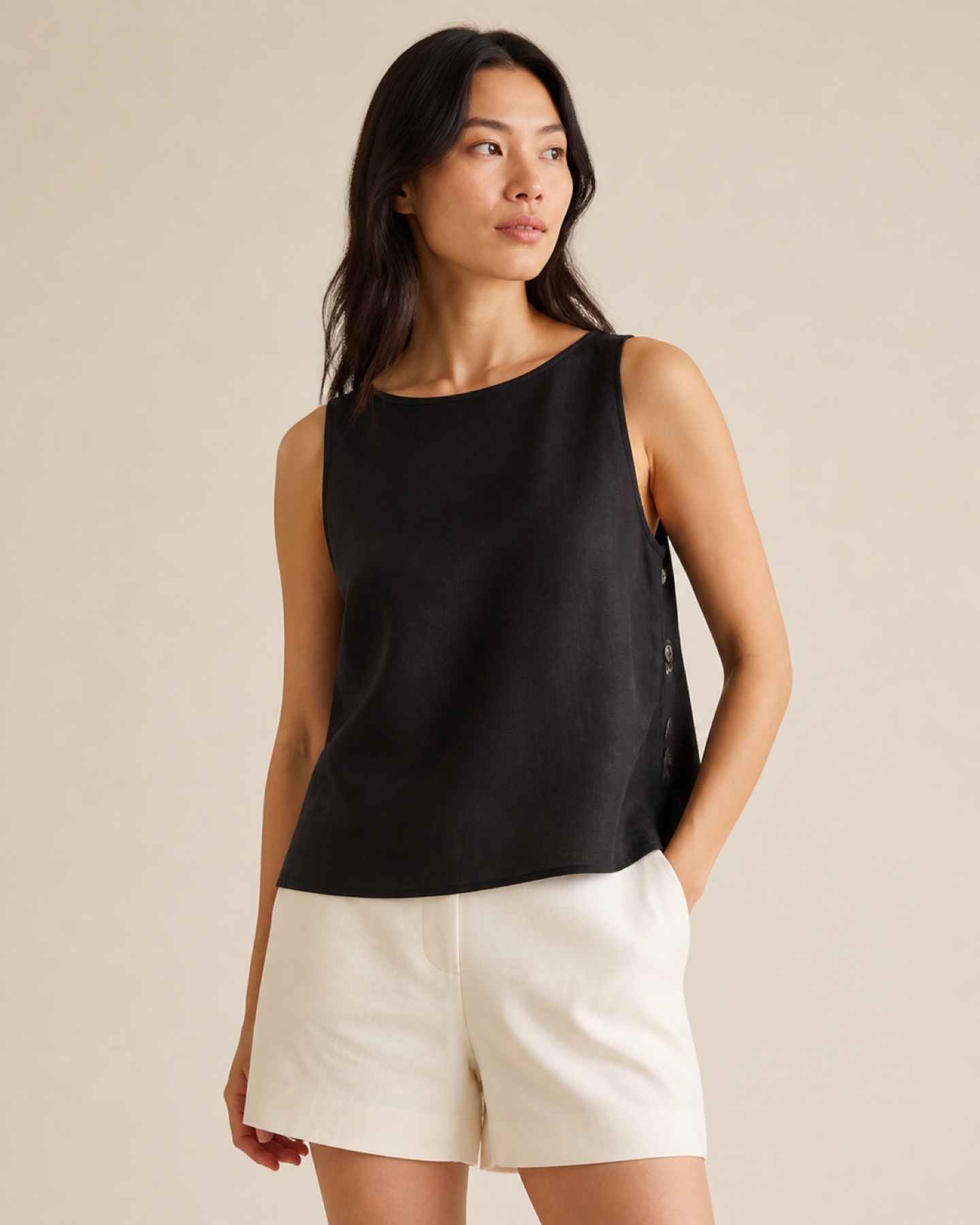 Model wearing Sleeveless Woven Blouse